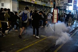 Police fire tear gas as Hong Kong rings in New Year