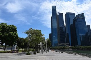 'Dead city': Singapore closes workplaces in virus fight