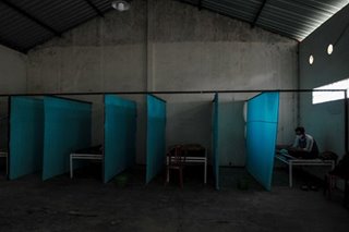 Indonesia locks virus violators in 'haunted house'
