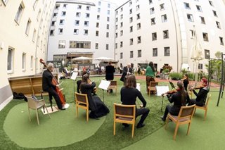 Opera returns to Vienna with hotel 'window concert'
