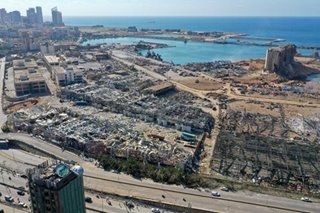 Lebanon president says negligence or missile may have caused port blast