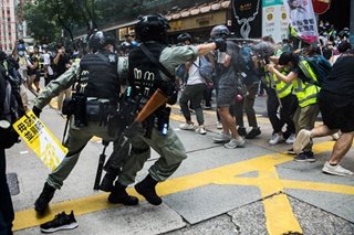 Two Hong Kong opposition lawmakers arrested over protests
