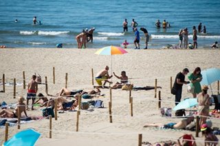 French minister defends 'precious' topless rights after sunbathers warned