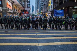 Hong Kong police swoop on postponed poll protests