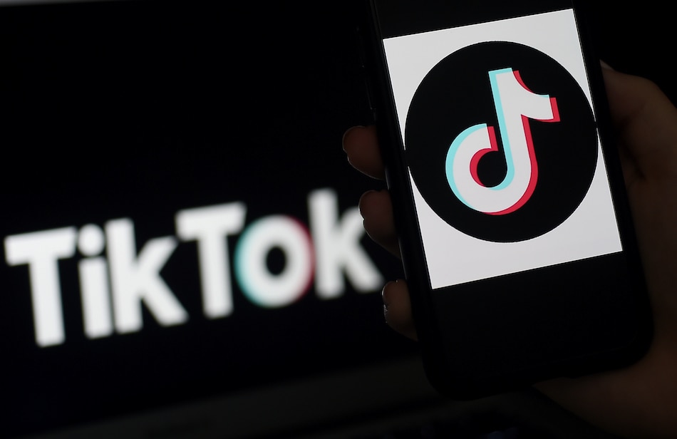 In this file photo taken on April 13, 2020, the social media application logo, TikTok is displayed on the screen of an iPhone, in Arlington, Virginia. Olivier Douliery, AFP/File