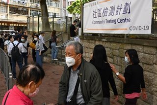 Surprise checkpoint at COVID-19-hit HK housing block uncovers 76 testing violators