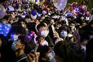 Crowds throng Wuhan, where pandemic began, to celebrate New Year