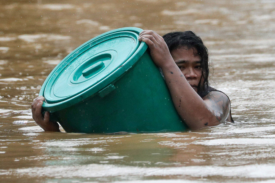 Marikina residents swim to safety as Ulysses causes flooding