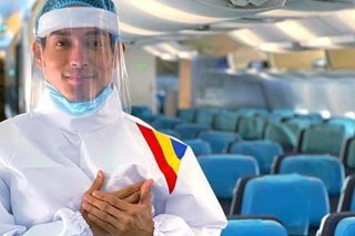 LOOK: Philippine Airlines cabin crew don protective suits in 'new normal'