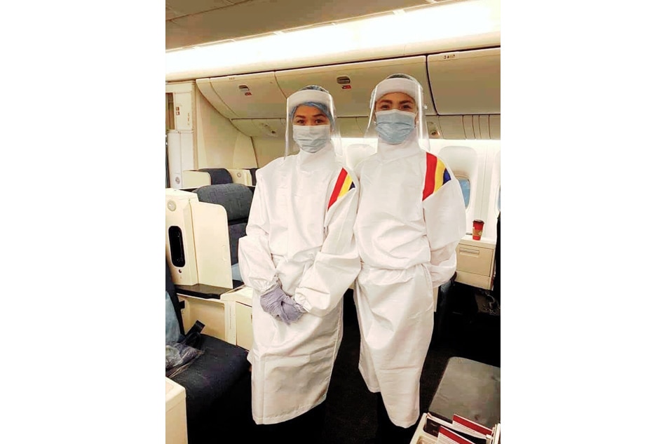 LOOK: Philippine Airlines cabin crew don protective suits in &#39;new normal&#39; 3
