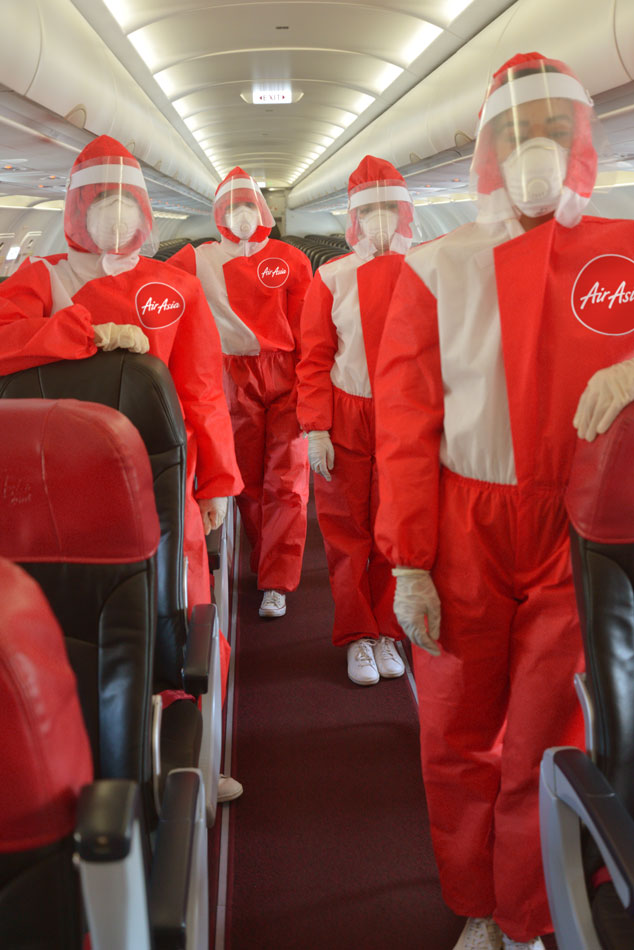 LOOK: AirAsia debuts protective suits against COVID-19 for flight crew 1