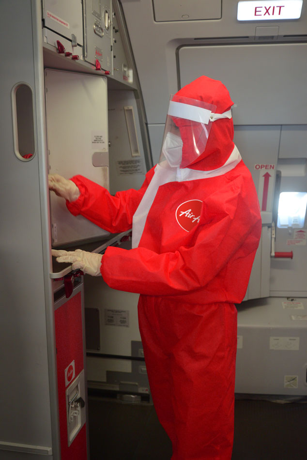 LOOK: AirAsia debuts protective suits against COVID-19 for flight crew 3