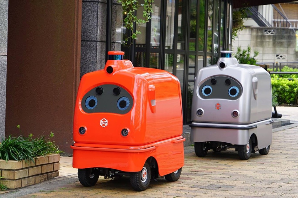 Mail delivery robot makes test run on Tokyo road amid pandemic ABS