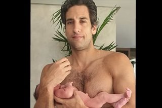 Nico Bolzico caught off-guard while taking care of baby daughter