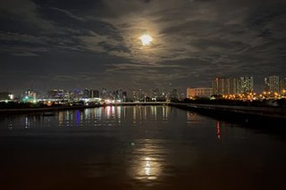 Snow moon rises over Pasay City
