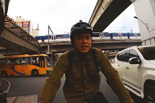 WATCH: Raimund Marasigan takes on rush hour traffic on bike