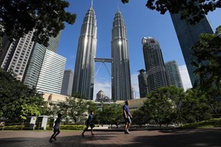 Malaysia slashes rates to fight virus impact