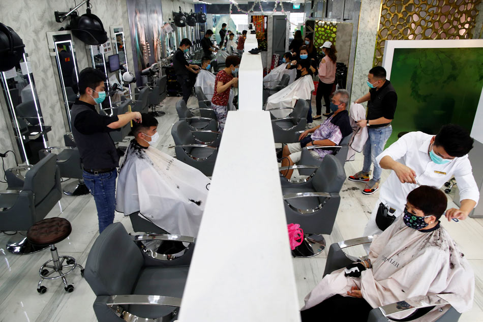 Groomed but still grounded Hairdressers reopen during Singapore