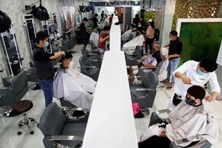 Groomed but still grounded: Hairdressers reopen during Singapore lockdown
