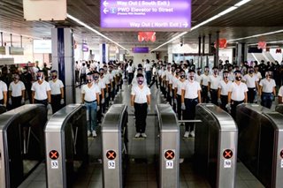 LOOK: It’s training day for PNP, LRT-2 as new normal sets in