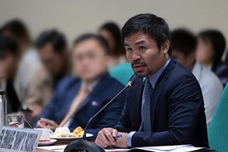 WATCH: LSIs in Manila NorthPort get free face shields, masks from Pacquiao
