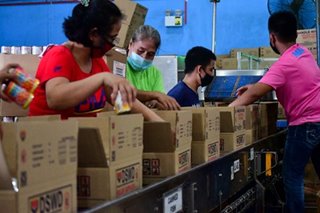 PH Coast Guard, volunteers pack relief goods for Rolly-affected areas