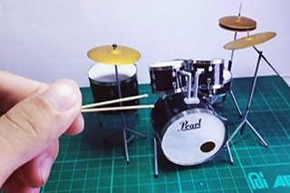 Gamit sa banda na gawa sa popsicle sticks, ibinida ng artist mula sa Palawan