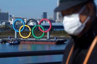Japan PM vows to press ahead with Olympics despite virus surge