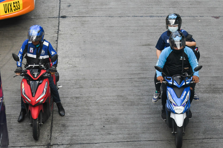 Riders of motor taxi-hailing firms Angkas and JoyRide are shown in this file photo. Mark Demayo, ABS-CBN News/file
