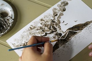 Filipina artist paints images of volcanic devastation using ash