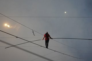 American daredevil walks tightrope across active volcano