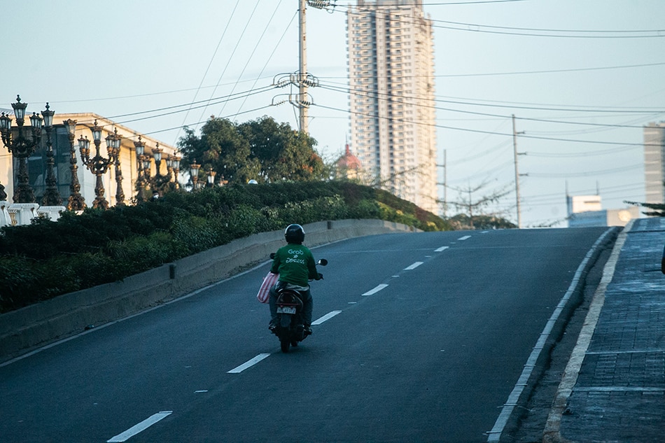 Frontliners on 2 wheels keep Philippine economy moving during COVID-19 lockdown 1
