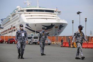 Filipino crew members ready to disembark from ship