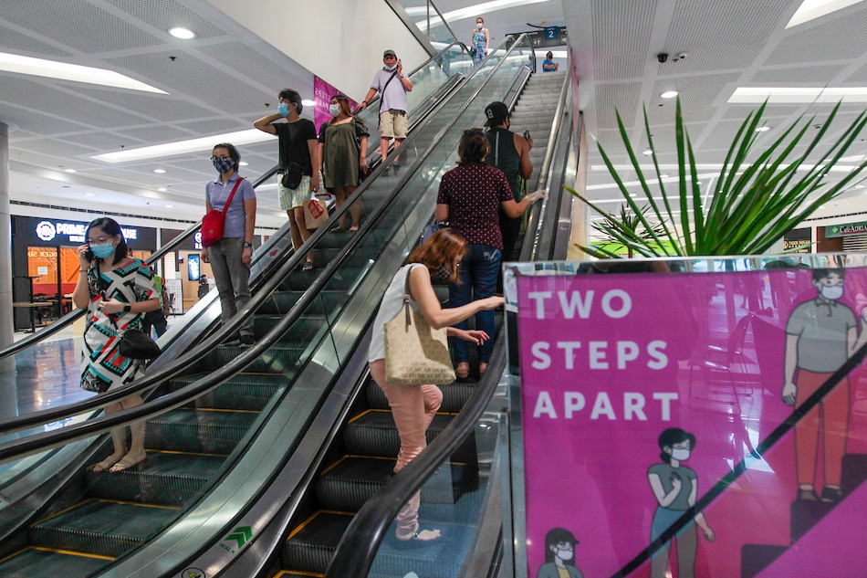 Social distancing and other protocols to curb the spread of COVID-19 are implemented inside a mall in Quezon City on May 27, 2020. Jonathan Cellona, ABS-CBN News/File