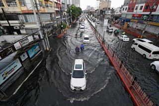 Downpour leaves Manila street flooded