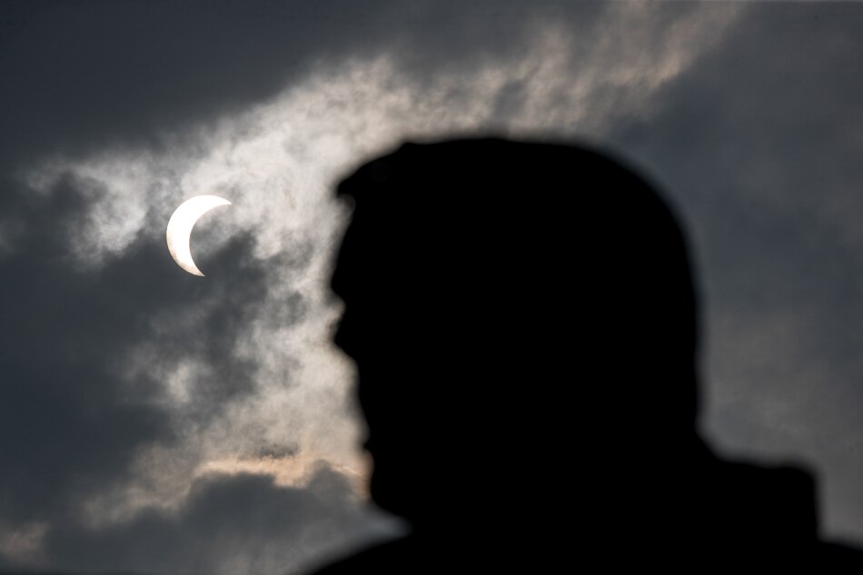 SLIDESHOW: Annular solar eclipse captivates sky gazers 11