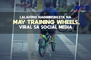 Lalaking nagbibisikleta na may training wheels, viral sa social media