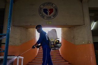 Disinfecting Rizal Memorial Stadium