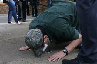 Duterte kneels, kisses ground of blast site in Jolo