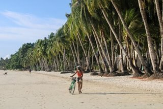 Wear anti-virus mask in Boracay, but remove when swimming: Tourism chief