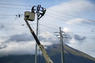 Electrical line repairs as Mayon peeks