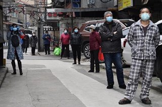 China lets some businesses resume in virus epicenter Wuhan