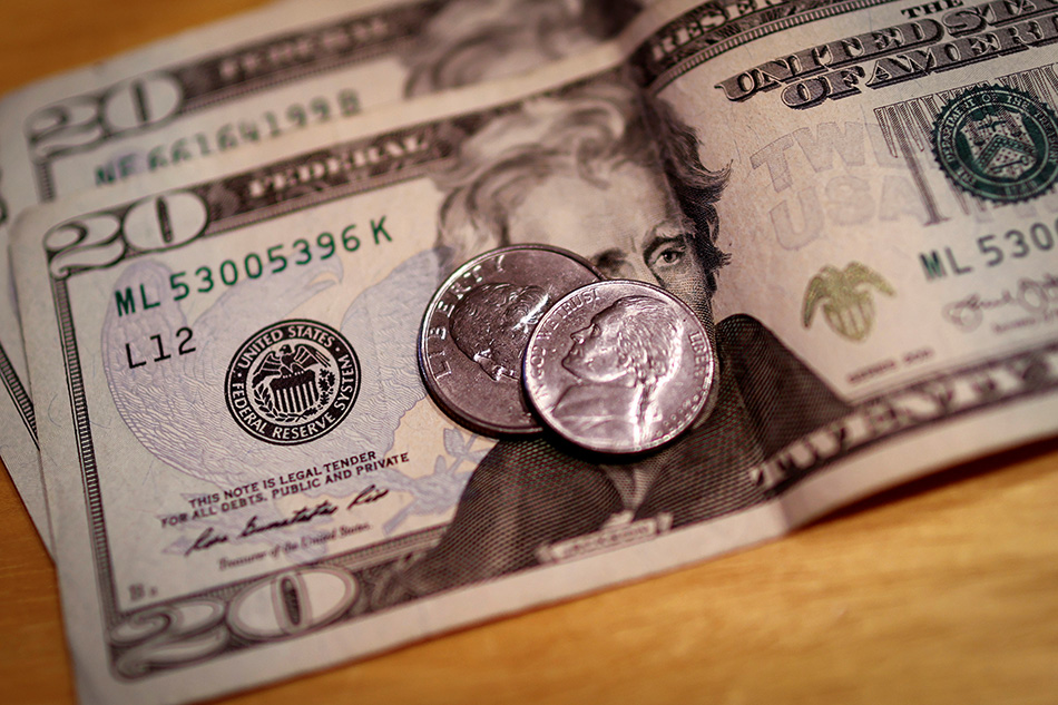 US Dollar Falls After Fed Cuts Rates to Zero and Launches QE
