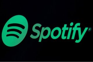 Spotify posts rare profit as paying users hit 158 million