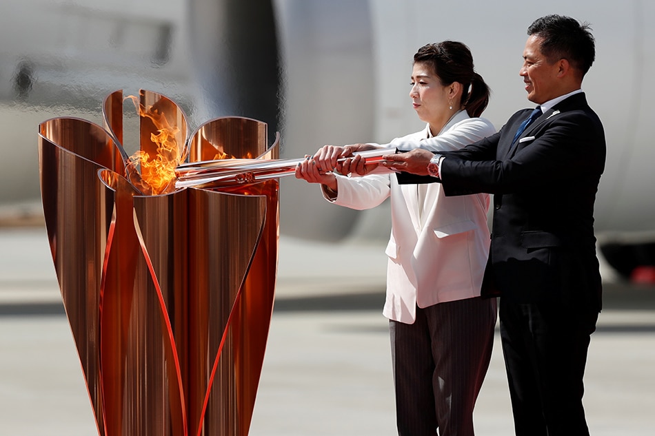 Japan ends Olympic flame display due to COVID-19 1