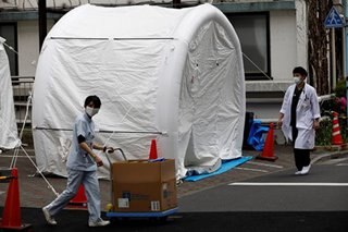 As coronavirus infections mount, Japan at last expands testing