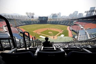 No spitting, no fans: baseball restarts S. Korea's sports season