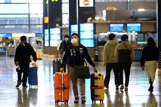 JAL cuts profit forecast more than 40 percent as virus bites