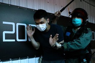 Hong Kong leader tries to reassure investors rattled by China law