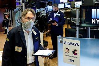 Floor trading resumes at NYSE, with masks and plexiglas